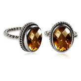 Handcrafted sterling silver Citrine Quartz ring with oval faceted Quartz and rope bezel, artisan jewelry from Indonesia.